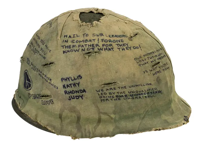 Helmet cover from Hamburger Hill. Courtesy of Salvador L. Gonzalez, 101st Airborne Division, 3rd Brigade, 1/506th Light Infantry, D Company, 1969<br/>